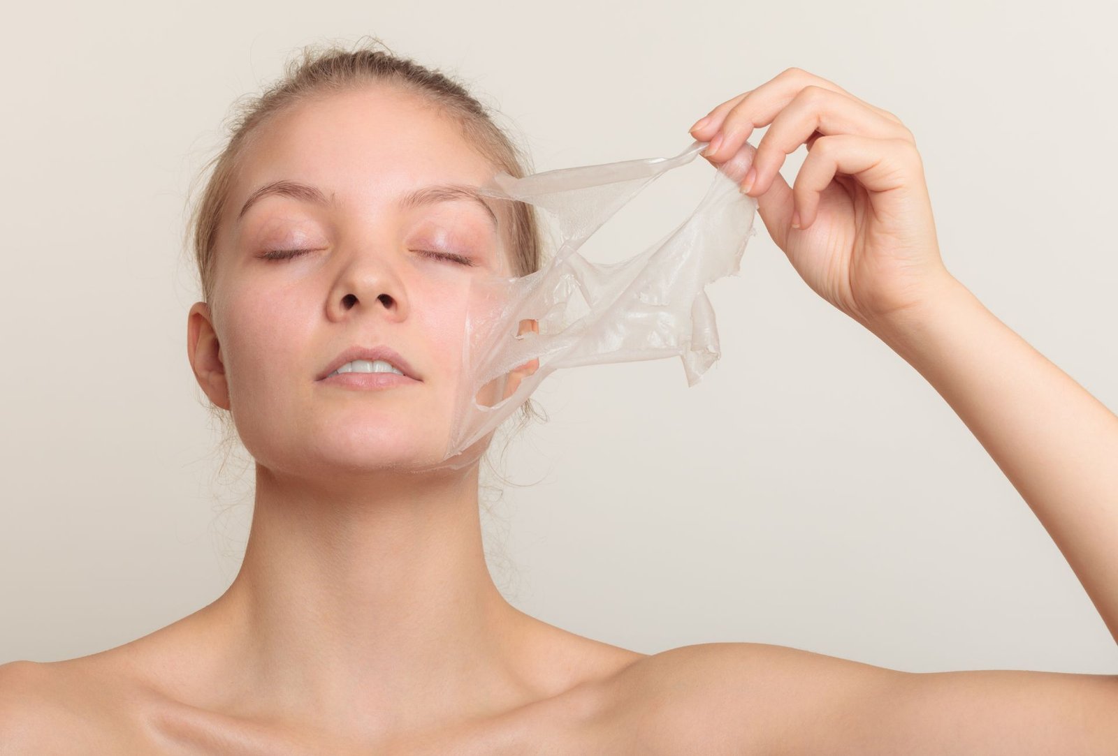 Woman receiving a facial peel treatment at a skincare clinic.